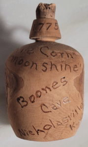 Front View of Boones Cave Moonshine Jug
