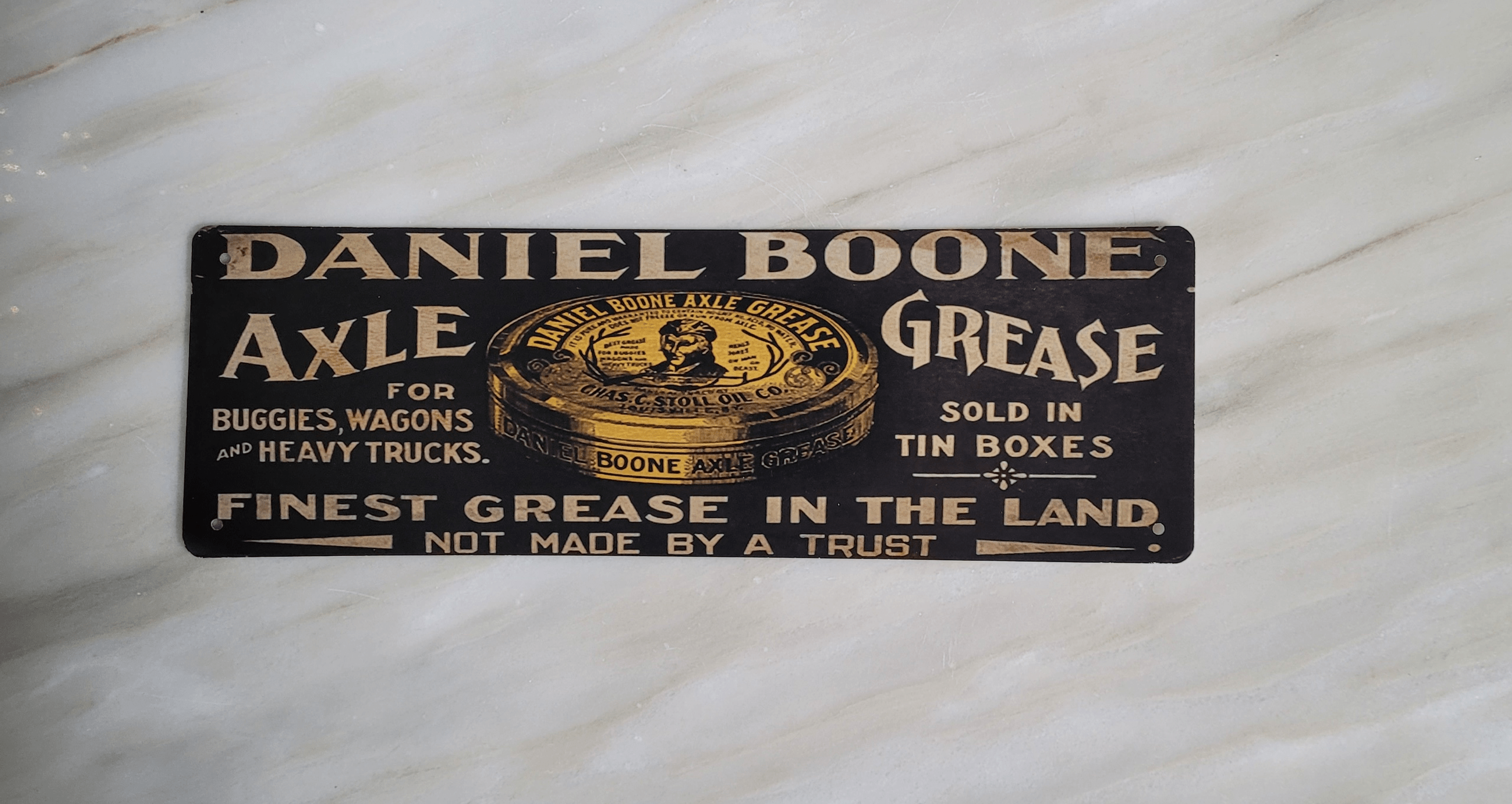 Front View of Daniel Boone Axle Grease Metal Sign
