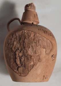 Side View of Boones Cave Moonshine Jug