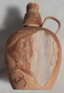 Side View of Boones Cave Moonshine Jug